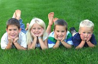 Children laying in the grass