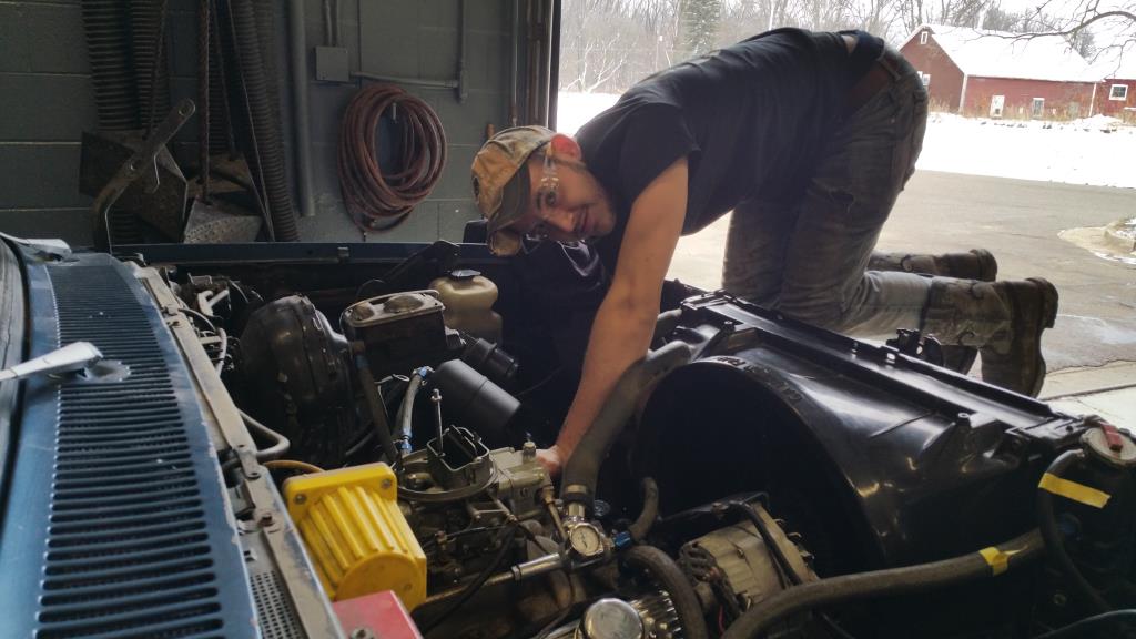 Student working on a car in diesel.