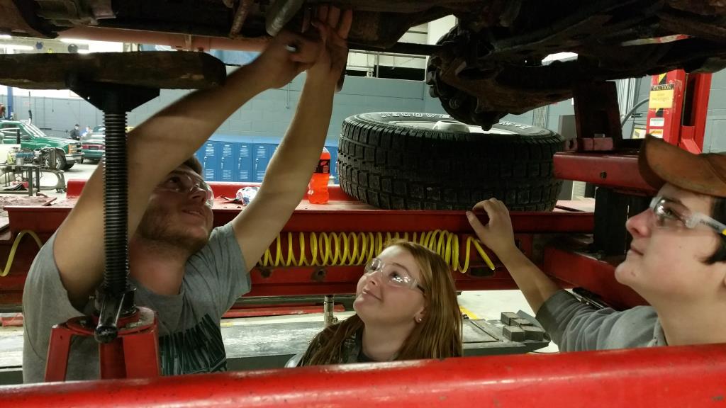 Students working on a car in diesel class.