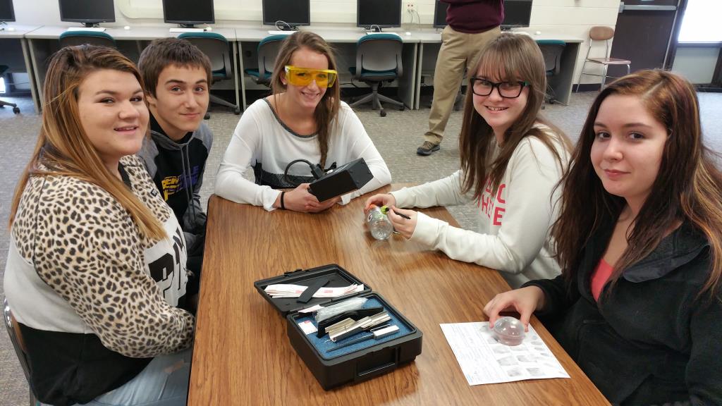 Students working with fingerprinting equipment.