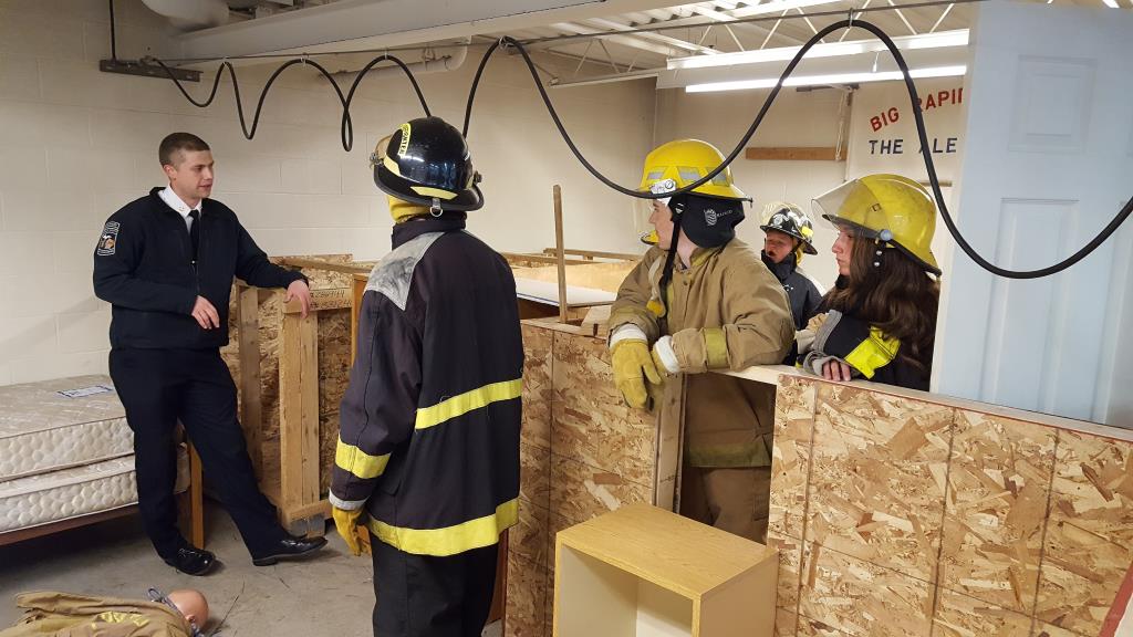 Criminal justice students working on fire training.