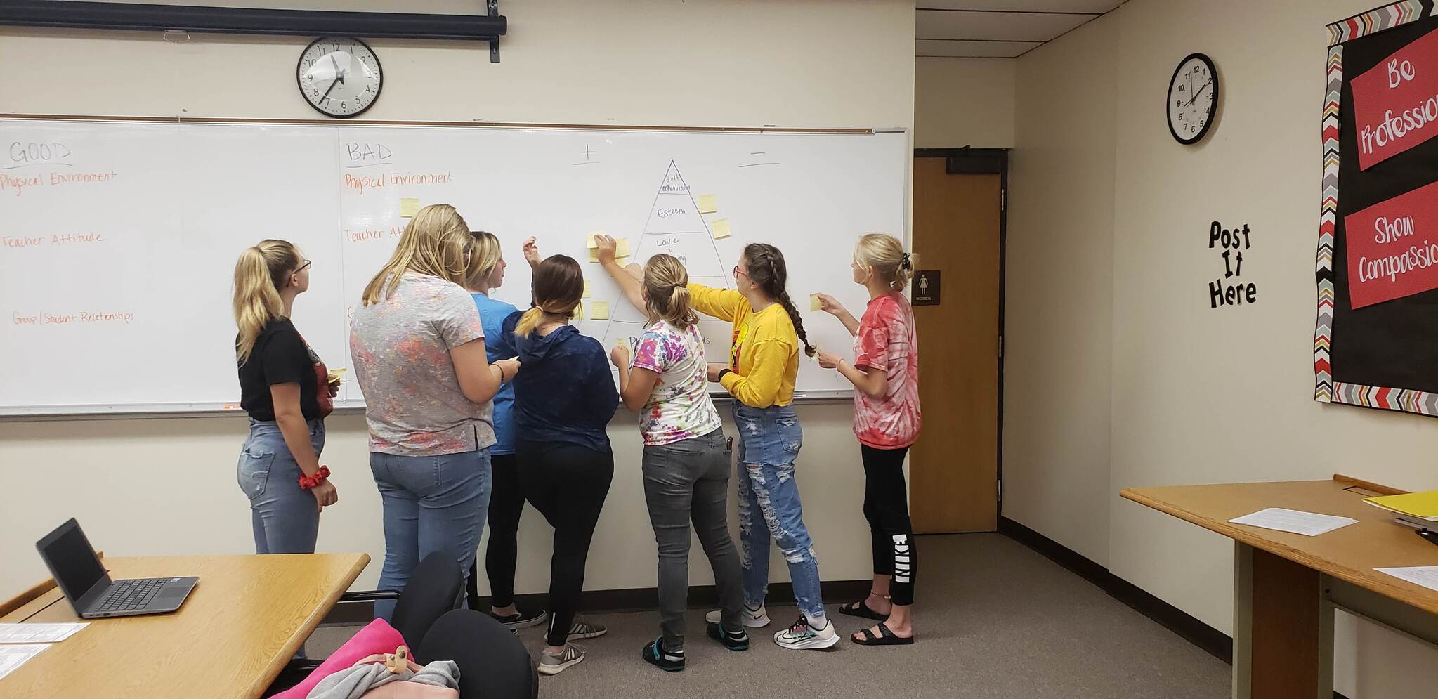 Educational Careers students working together at the white board.