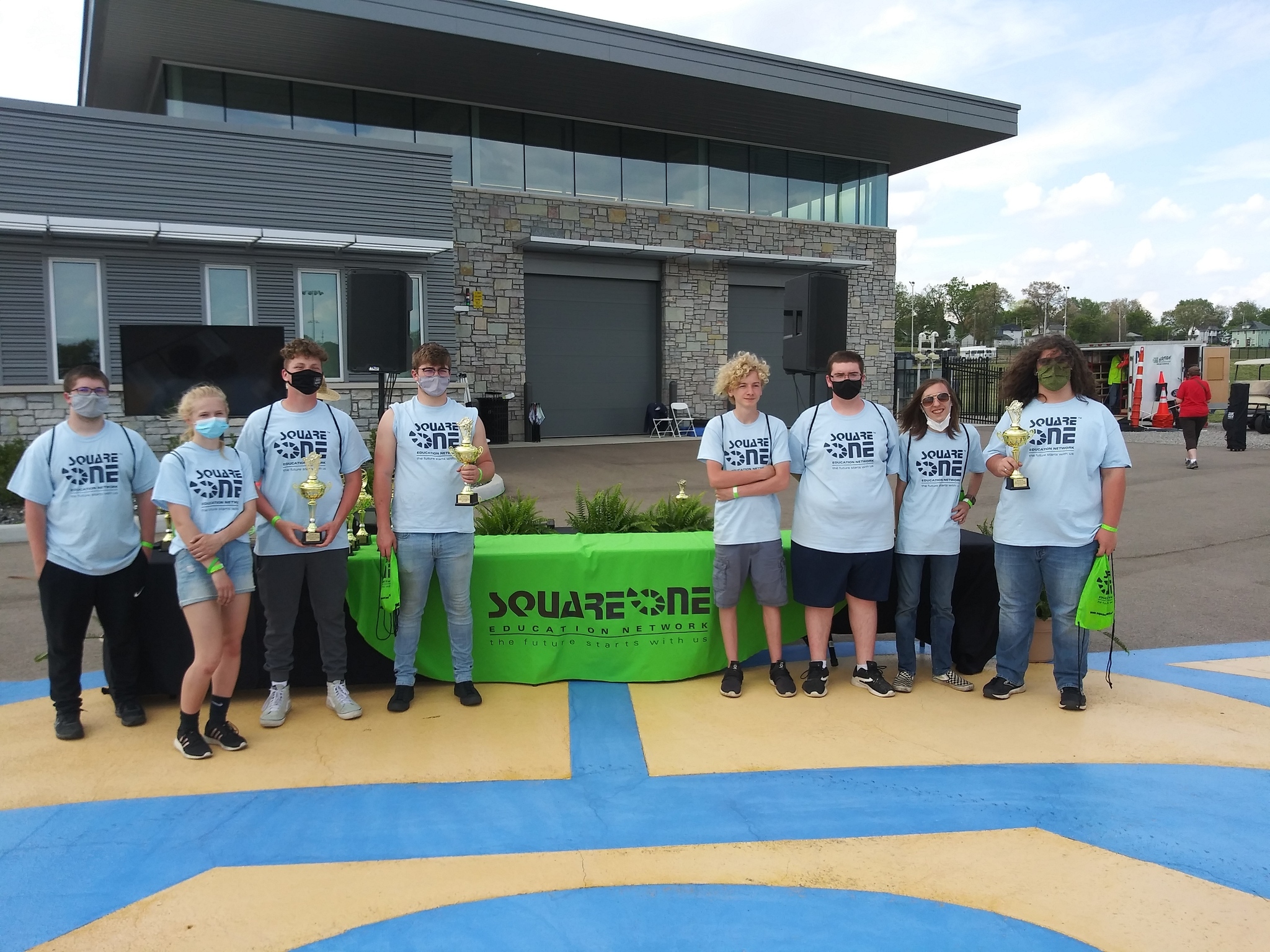 CAD students taking a group picture at the Square One electric car race.