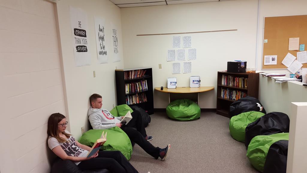 English students enjoying their reading area, complete with comfy beanbags.