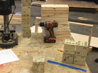 The construction students are working on building yard dice.