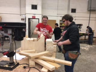 Construction students working on yard games.