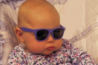 Baby with sunglasses on.